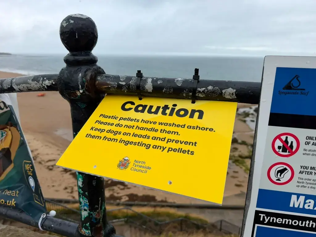 North Tyneside Council yellow caution sign about plastic pellets washed ashore